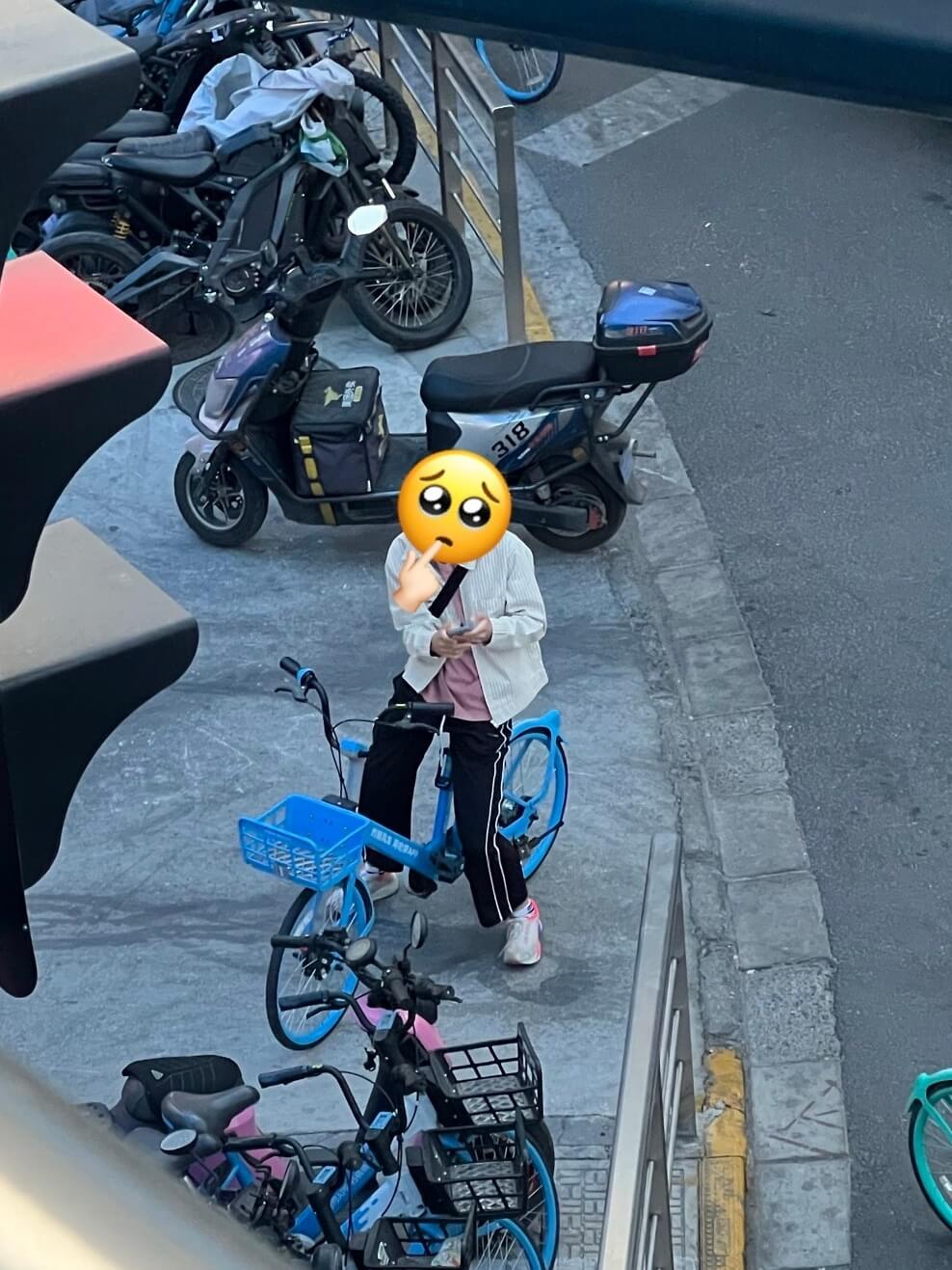Yuxi riding a bicycle